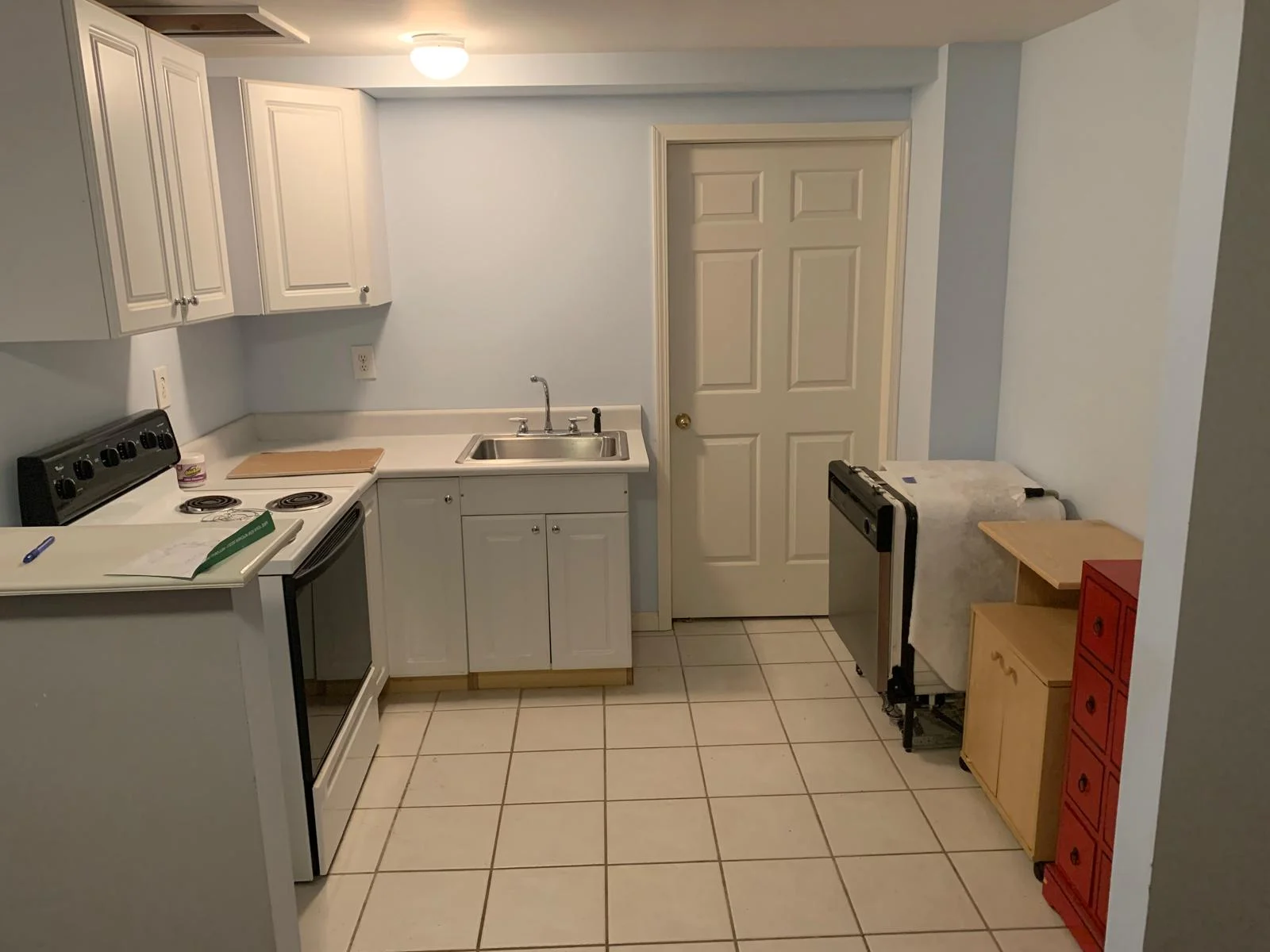 Kitchen before remodel — outdated cabinets and old countertops