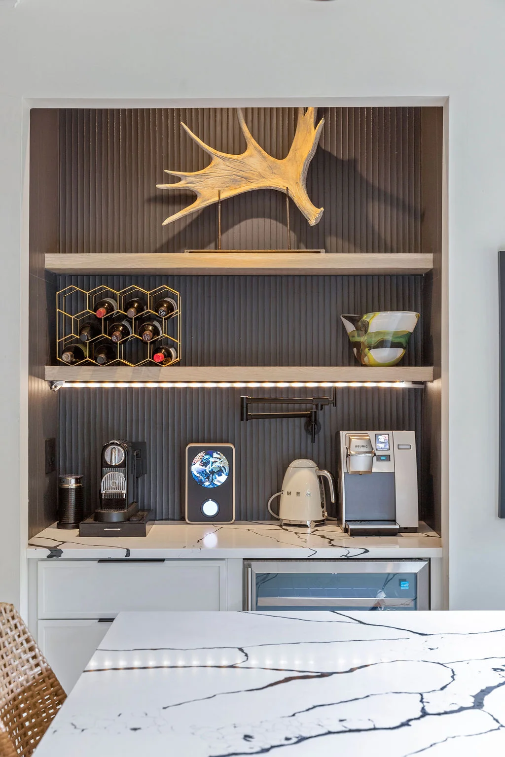 Custom wine bar after renovation — built-in shelving and premium finishes